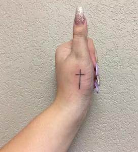 Cross Tattoo On The Thumb