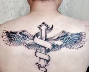 Winged Cross Tattoo On The Back